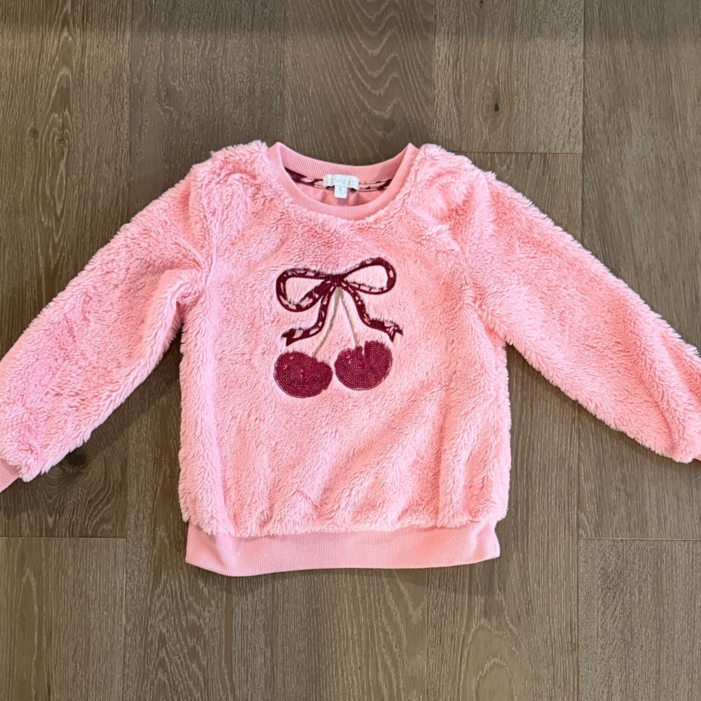 Between pink fuzzy cherries sweater. Size:6. Gently Used.